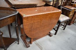 An early to mid 20th Century oak gateleg table