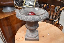A traditional cast Campagna style urn , of small proportions, height approx. 31cm, selling for St