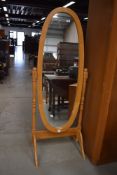 A modern rubberwood cheval mirror