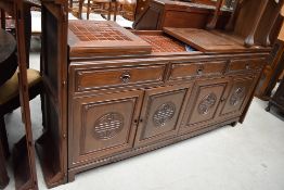 An Oriental hardwood bar/sideboard, lid top exposing tiles, some damage to tiles, width approx.