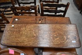 An interesting oak fold out wall shelf, having stag cartouche applique, width approx. 87cm