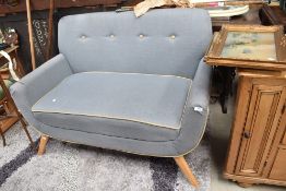 A vintage style settee in blue/grey with beech splay legs, width approx. 122cm