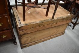 An antique pine chest having dovetail carcass with flat plank top