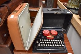 Two vintage typewriters, Olympia and Underwood