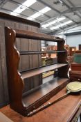 A Period style oak plate rack, been wall mounted but would free stand on base, width approx.