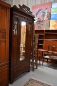 A Victorian mahogany mirror door single wardrobe