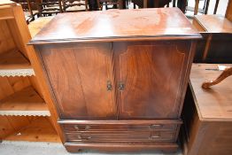 A reproduction Regency style TV cabinet