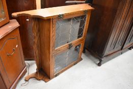 A Priory style oak wall display cabinet