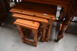 A modern pine nest of three tables