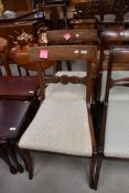 A pair of 19th Century Regency style railback dining chairs having later upholstery
