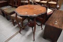 A late 19th or early 20th Century mahogany occasional table having shaped top and undertier