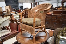 A vintage wicker work tub chair