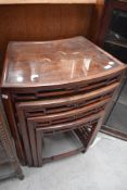 An Oriental nest of three hardwood tables having horse inlay decoration