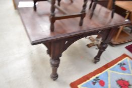 A square early 20th century kitchen preparation table having turned legs on oak framework