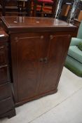 A reproduction mahogany TV or HIFI cabinet