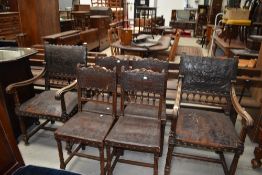 A set of six (four plus two) period style oak frame chairs having embossed leather detailed seats