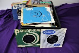 A box of 130 7' singles - lot are in original company bags - a mixed selection from the 1960's