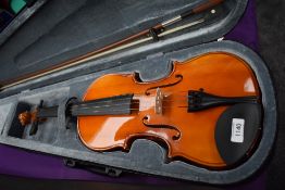 A Stagg violin in plush case, width bow