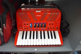 A Roland Electronic Accordion .Model FR-1X in red, Italian Made