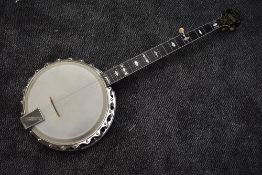 An early 20th Century banjo by Clifford Essex, circa 1905, mother of pearl detailing including
