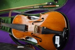 A traditional violin, probably German, labelled for importers Frank A Rolph, and Stradivarius copy
