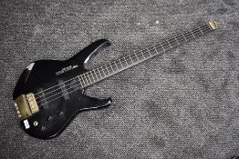 A Washburn Status headless bass guitar and bag