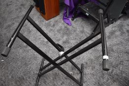 A folding keyboard stand with clamp lock style mechanism