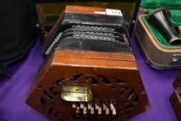 A traditional 48 button concertina, probably Lachenal late 19th/early 20th Century, some splitting