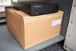 A Russ Andrews boxed PA1 Power Amplifier - a high end amplifier that comes from the same