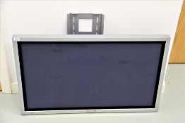 A Panasonic Plasma Screen with wall brackets and all relevant controls and instruction manuals
