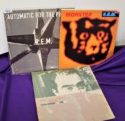 A lot of three vinyl albums by REM