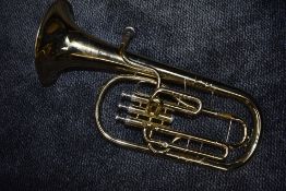 A brass horn, named for B and S, Sonora range, with mouthpiece and vinyl carry bag