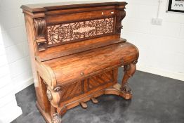 An interesting 19th Century mahogany pianette (73 keys) having fretwork back panel , and animalistic