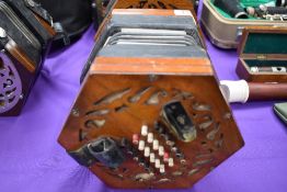 A traditional 48 button concertina, labelled Lachenal, on cloth interior , probaby late 19th/early