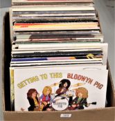 A lot of one hundred vinyl albums , 12' singles and more - a real mixed bag from rock , pop , folk ,