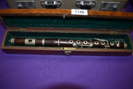 A late 19th or early 20th Century rosewood fife flute, with oak felt lined case