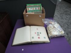 A box of World stamps, mainly used, in album and loose