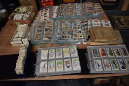 A collection in albums and loose of Cigarette Cards and Trade Cards, many sets seen