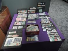 A collection of mint Commonwealth Stamps on hangers and loose in tin, Victoria to George VI