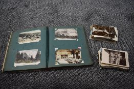 A collection of UK and World Postcards in album and loose, mainly GB, black & white and colour cards