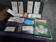 A collection of mint & used modern Canada Stamps in albums, folders and loose and a collection of