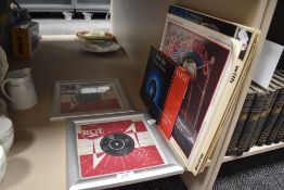 Two framed Elvis Presley 45's and a small amount of mixed vinyl lps and singles.