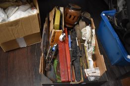 A mixed box of tools including jack, socket sets and more.