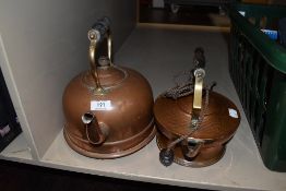 Two vintage copper kettles.