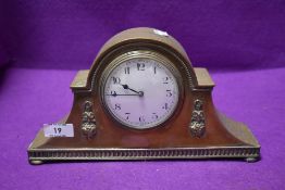 A brass cased late Victorian mantle clock having enamel face dial marked Made In France
