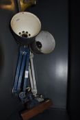 Two industrial bench mounted angle poise style lamps