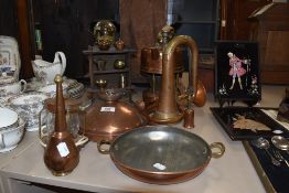 A mixed lot of copper items including miniatures with wooden cupboard,lamp and more.