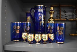 A blue glass jug and glass set also similar wares in a Venetian style