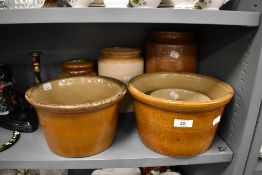 Two stone ware bake pots and three similar stone ware jars salt glazed