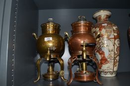 Two late Victorian samovar with spirit burners one brass cased marked Imperial and similar copper